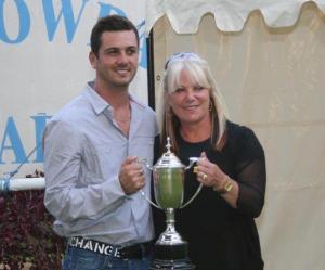 Gokhan Terzi accepts the Derby Trophy, on behalf of Mr S. Armstrong, from Nadia Barnwell width=